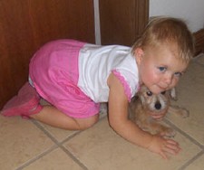 Hannah playing mother to a Schnoodle